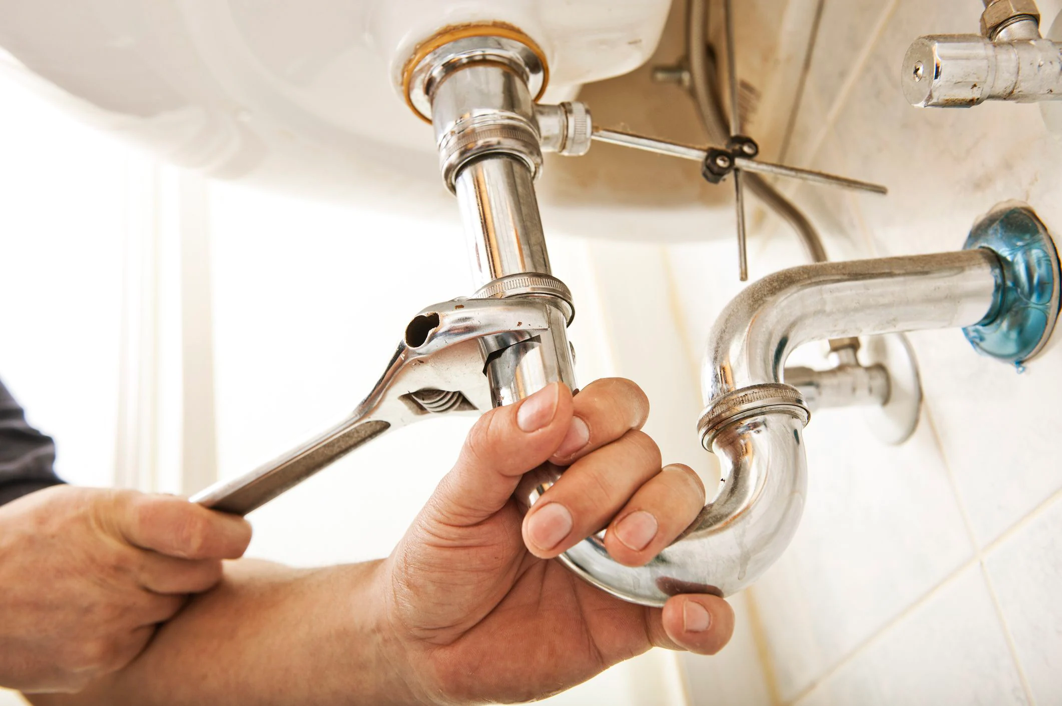 Plumber fixing pipe